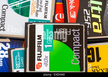 Scattered old computer, camera memory cards in small pile. Mainly 1 GB card ofrom various makes, all Compact Flash type. Stock Photo