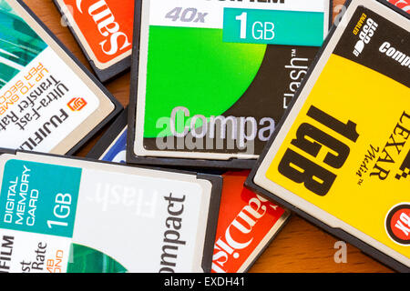 Scattered old computer, camera memory cards in small pile. Mainly 1 GB card ofrom various makes, all Compact Flash type. Stock Photo