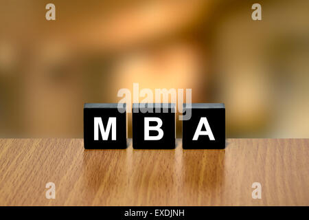 MBA or Master of Business Administration on black block with blurred background Stock Photo