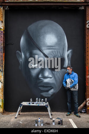 Cookson St car park site, Blackpool, Lancashire, UK. 12th July, 2015. Portrait of Samuel Jackson by Christian Fenn (Seca) painter at the Sand, Sea & Spray Urban Art Weekend.  Forty leading urban artists from four continents paint Blackpool for the annual Sea, Sand and Spray festival, which is a international weekend event showcasing diverse street art. The attraction in various town centre locations has already created a number of outdoor galleries refreshing existing spaces and creating new pieces.