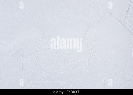 The texture of a white wallpaper designed to look like plaster. Stock Photo