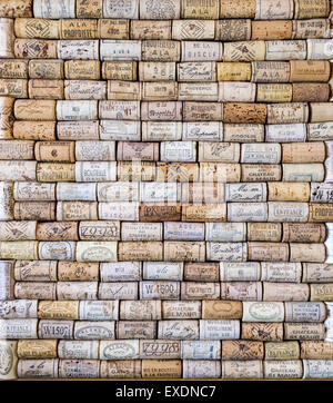 Wine corks from various wine bottles and vineyards arranged in rows Stock Photo