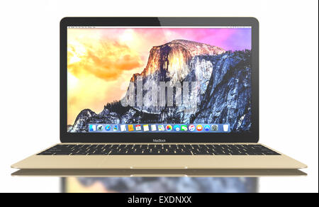 New Silver MacBook displaying OS X Yosemite. It has a 12-inch Retina display with a resolution of 2304 x 1440. Stock Photo