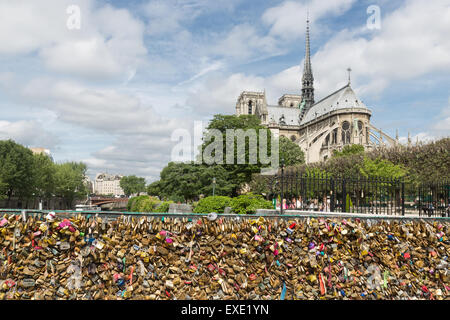 Love padlocks representing eternal love of couples who lock padlocks at the bridge Pont de L'Archeveche  in Paris, France Stock Photo