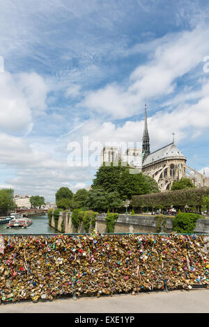 Love padlocks representing eternal love of couples who lock padlocks at the bridge Pont de L'Archeveche  in Paris, France Stock Photo