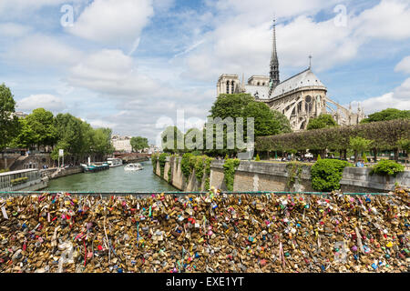 Love padlocks representing eternal love of couples who lock padlocks at the bridge Pont de L'Archeveche  in Paris, France Stock Photo