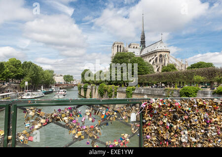 Love padlocks representing eternal love of couples who lock padlocks at the bridge Pont de L'Archeveche  in Paris, France Stock Photo