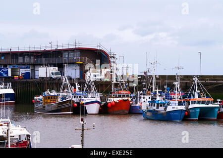 Colourful fishing boats tied up at Bridlington Harbour, East Riding of Yorkshire, England, UK Stock Photo