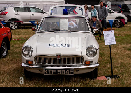 Glamis, Scotland, UK. 12h July, 2015. 1968 MG MGB GT Police car at the 41st Scottish Transport Extravaganza held at Glamis Castle exhibiting Vintage cars from 1890-1975.  Credit:  Dundee Photographics/Alamy Live News Stock Photo