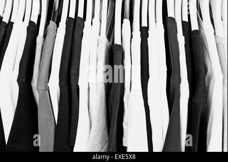 Black white and grey casual tops on a clothing rack Stock Photo
