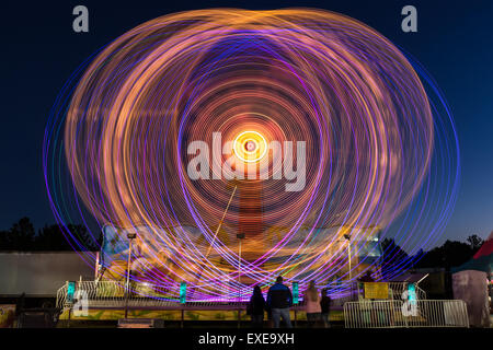 Long exposure night photograph of the Ali Baba Carpet Ride at the Northeast Florida Fair in Callahan, Florida. Stock Photo