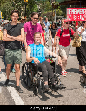 New York, USA. 12th July, 2015. People with disabilities and their supporters march down Broadway from Madison Square Park in New York for the First Annual Disability Pride Parade on Sunday, July 12, 2015 celebrating the 25th anniversary of the signing of the Americans With Disabilities Act (ADA).  The ADA ensured accessibility to the disabled and removed barriers to employment, transportation, public accommodations, public services and telecommunications. Credit:  Richard Levine/Alamy Live News Stock Photo