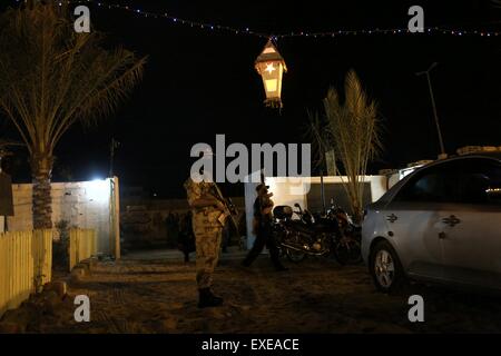 Gaza, Palestine. 12th July, 2015. Militants from al-Nasser Salah al-Deen Brigade, the military wing of the Popular Resistance Committees march during an anti-Israel rally marking the first anniversary of the 50-day Israeli war on Gaza Strip last summer. © Nidal Alwaheidi/Pacific Press/Alamy Live News Stock Photo