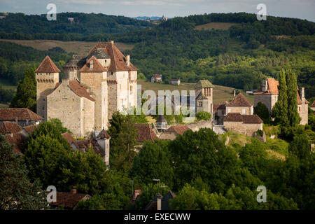 Evening sunlight over Château des Plas and medieval town of Curemonte, in the ancient Department of Limousin, Correze, France Stock Photo