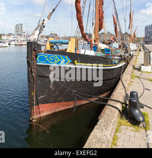 Historic sailing barge at quayside mooring in the Wet Dock, Ipswich, Suffolk, England Stock Photo