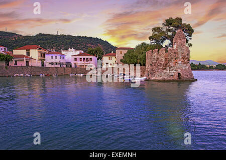 Close view to Nafpaktos medieval harbour and lighthouse at sunset in Aetoloacarnania prefecture,  Sterea Ellada, Greece Stock Photo