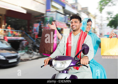 2 indian Rural Married Couple Highway road Riding Scooty Stock Photo