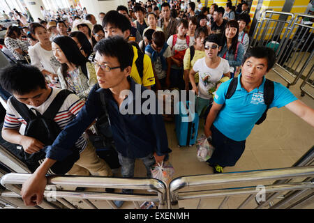 Lanzhou, China's Gansu Province. 13th July, 2015. Passengers wait for their train at Lanzhou Railway Station in Lanzhou, capital of northwest China's Gansu Province, July 13, 2015. Lanzhou Railway Station recently witnessed its first travel peak this summer. © Chen Bin/Xinhua/Alamy Live News Stock Photo