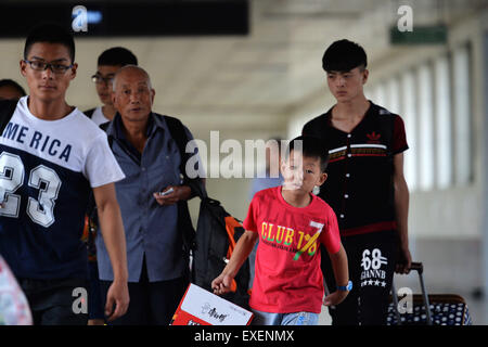 Lanzhou, China's Gansu Province. 13th July, 2015. Passengers prepare to board their train at Lanzhou Railway Station in Lanzhou, capital of northwest China's Gansu Province, July 13, 2015. Lanzhou Railway Station recently witnessed its first travel peak this summer. © Chen Bin/Xinhua/Alamy Live News Stock Photo