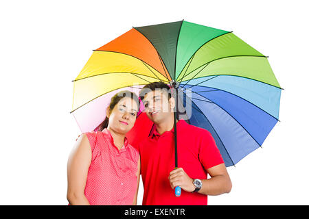 2 indian Married Couple  Umbrella Rain Protection Stock Photo