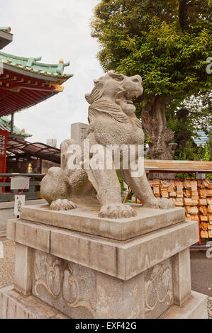 Komainu statue guard of Kanda Myojin Shinto Shrine in Tokyo, Japan. Komainu is lion-dog creature meant to ward off evil spirits Stock Photo