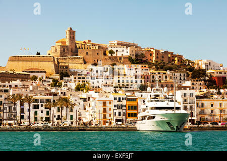 Ibiza Old Town from harbour yacht in port harbor Spain Spanish island huge boats rich moored Stock Photo