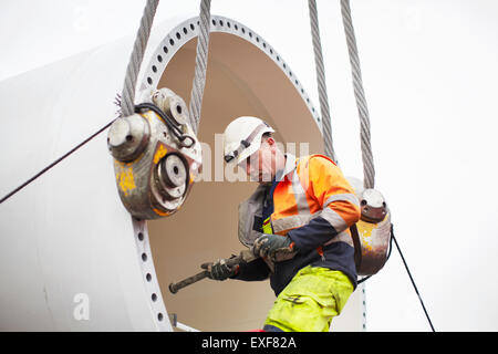 Engineer working on wind turbine Stock Photo