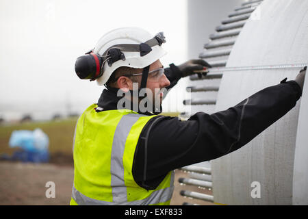 Engineer working on wind turbine Stock Photo