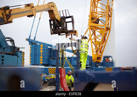 Engineers working at wind farm Stock Photo