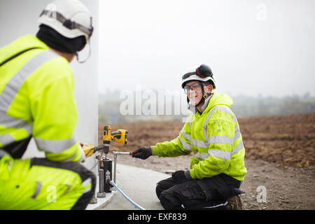 Engineers working on wind turbine Stock Photo