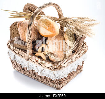 Different types of bread in the basket on a white background. Stock Photo