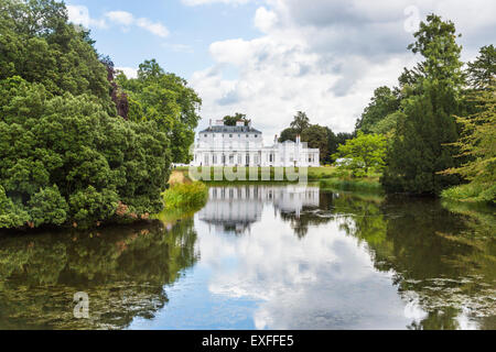 Frogmore House, Windsor, Berkshire, UK with reflections of the blue sky and white fluffy clouds in the lake in summer Stock Photo