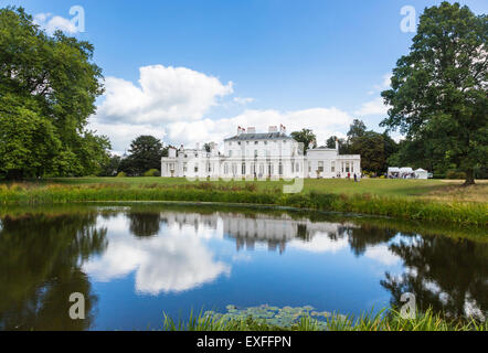 Frogmore House, Windsor, Berkshire, UK with reflections of the blue sky and white fluffy clouds in the lake in summer Stock Photo