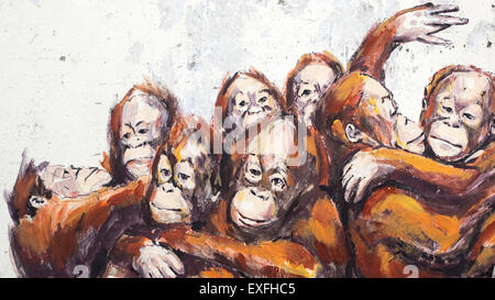 Orangutans in a Wheelbarrow street art mural by Lithuanian artist Ernest Zacharevic in Kuching, Sarawak, Malaysia. Stock Photo