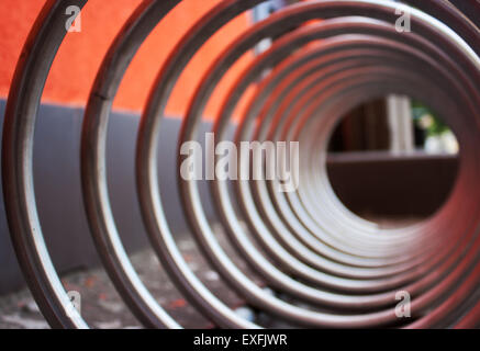 fragment of large metal spiral as an abstract geometric shape outside closeup Stock Photo