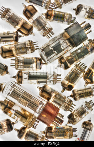 Collection of old used glass vacuum tubes used in radio and early tv crt amplifiers anode and cathode with filament collectors Stock Photo