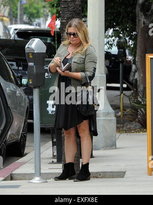 Ex baywatch babe Nicole Eggert feeds the meter before heading for ...