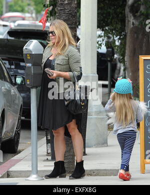 Ex baywatch babe Nicole Eggert feeds the meter before heading for ...
