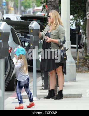 Ex baywatch babe Nicole Eggert feeds the meter before heading for ...