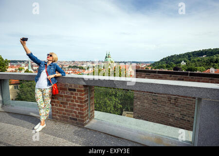 young woman doing a selfie on terraces of prague castle, Prague, Czech Republic, europe Stock Photo