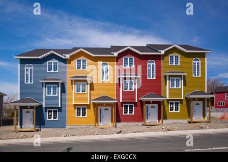 Four brand new colourful row houses on a sunny day in St. John's, Newfoundland. Stock Photo