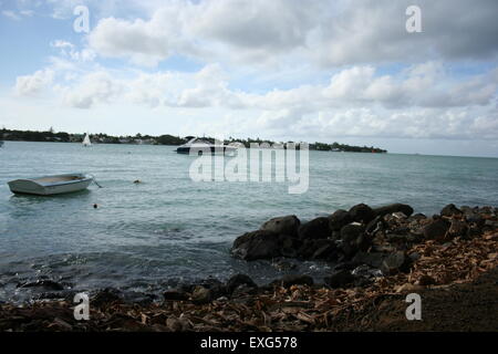 sea found at grand baie with rocks and boats in mauritius gorgeous Stock Photo