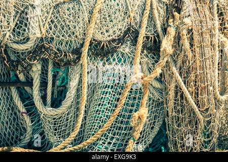 Old fishing nets and ropes. Filtered shot Stock Photo