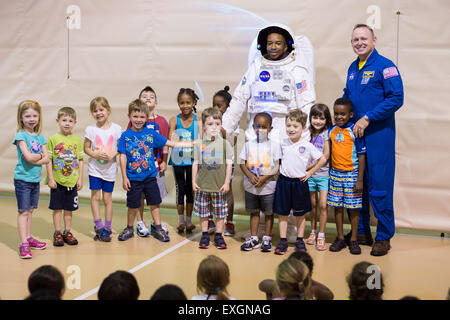 Astronaut Barry &quot;Butch&quot; Wilmore poses for a group photo with a teacher and his students on Wednesday, June 24, 2015 at the Joint Base Anacostia-Bolling Summer Camp in Washington, DC. Stock Photo