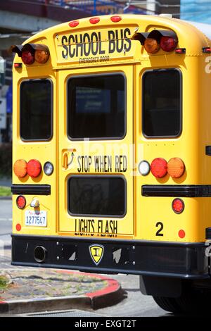 Rear View Of An Iconic American School Bus. Stock Photo