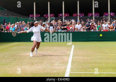 Serena Williams warms up for play helped by coach Patrick Mouratoglou, during the Wimbledon Championships 2015 Stock Photo