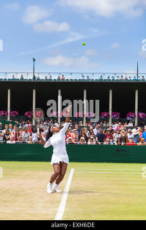 Serena Williams warms up her serve on court No. 5 during the Wimbledon Championships 2015 Stock Photo