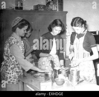 A Home Economics class session at Bethel Springs School, showcasing students engaged in practical lessons. The class emphasizes daily living skills, such as cooking, budgeting, and sewing. Students participate in hands-on activities designed to enhance their personal and family life management. Stock Photo