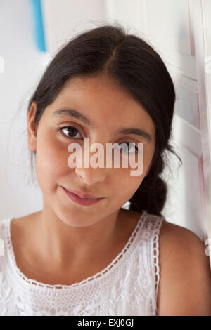 Portrait of a dreamy teenage girl in her room Stock Photo