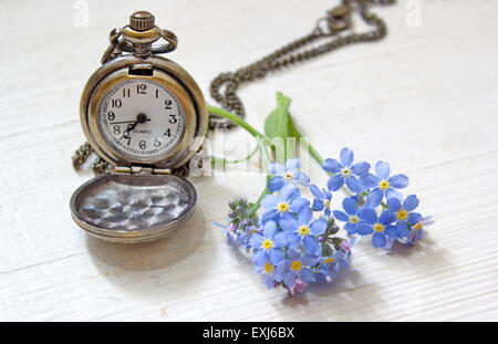 old pocket watch with forget me nots Stock Photo